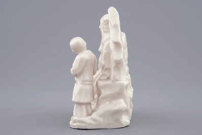 A Chinese Dehua blanc de Chine group of an immortal with a boy, 18/19th C.