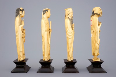 A set of 8 fine Chinese carved ivory immortals on wooden bases, 19th C.