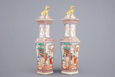 A pair of hexagonal Chinese famille rose mandarin vases and covers, Qianlong, 18th C.