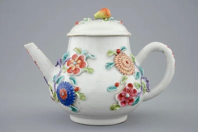 A Chinese moulded and applied famille rose teapot and cover on stand, Yongzheng, 1723-1735