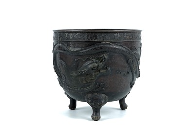 A large Japanese bronze relief-decorated jardiniere with a dragon and phoenix, Meiji, 19th C.