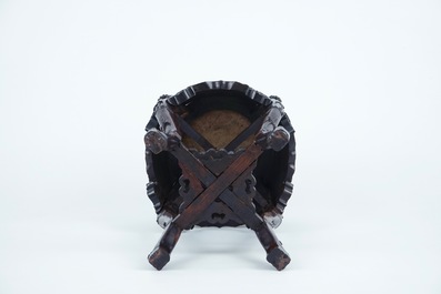 A carved round Chinese wood stand with marble top, 19/20th C.