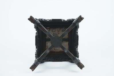 An intricately carved square Chinese wood stand with marble top, 19th C.