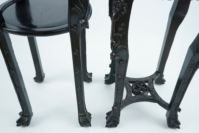 Two tall round Chinese carved wood stands with marble top, 19/20th C.