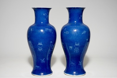 A pair of Chinese powder blue ground vases with incised decoration, 19th C.