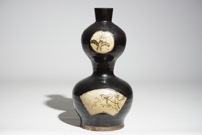 A Chinese black-glazed cizhou double gourd vase, Yuan or Ming
