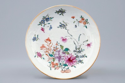 A Chinese clobbered blanc de chine cup and saucer with moulded dragon design, 18th C.