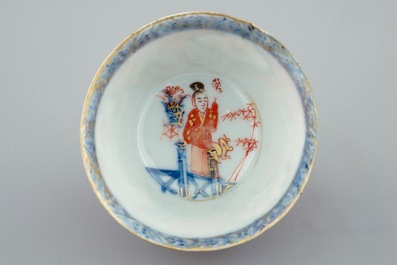 A Chinese blue and white on coral ground cup and saucer, Kangxi