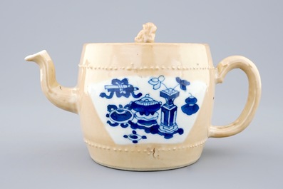 A Chinese blue and white on caf&eacute; au lait ground teapot and cover, Kangxi