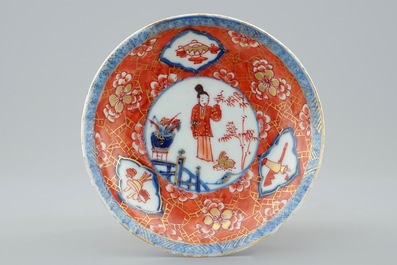 A Chinese blue and white on coral ground cup and saucer, Kangxi