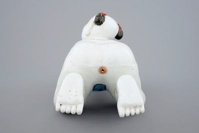 A large Chinese porcelain pillow in the form of a kneeling boy, 18th C.