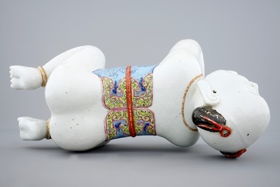 A large Chinese porcelain pillow in the form of a kneeling boy, 18th C.