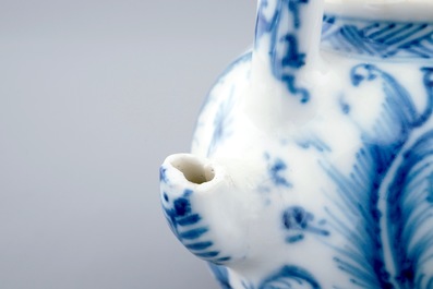 A small Chinese blue and white gate-handled teapot and cover, Kangxi