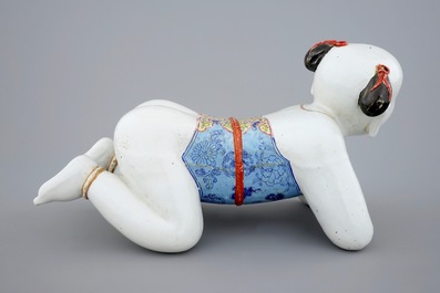 A large Chinese porcelain pillow in the form of a kneeling boy, 18th C.