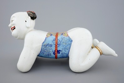 A large Chinese porcelain pillow in the form of a kneeling boy, 18th C.