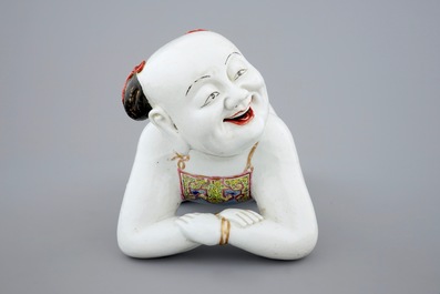 A large Chinese porcelain pillow in the form of a kneeling boy, 18th C.