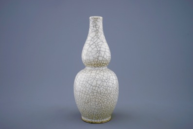 A Chinese monochrome crackle glazed double gourd vase, 19th C.