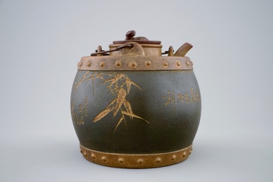 An inscribed Chinese Yixing teapot and cover with inset, 20th C.