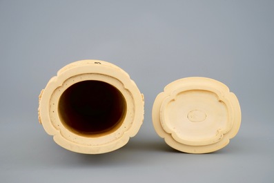 A very fine Chinese carved ivory vase and cover with figures in a landscape, ca. 1900