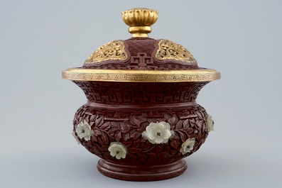 An unusual round Chinese lacquer box and cover with jade inset, 19/20th C.