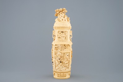 A very fine Chinese carved ivory vase and cover with figures in a landscape, ca. 1900