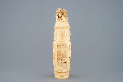 A very fine Chinese carved ivory vase and cover with figures in a landscape, ca. 1900