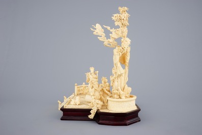 A large Chinese carved ivory group of musicians on a wooden base, early 20th C.