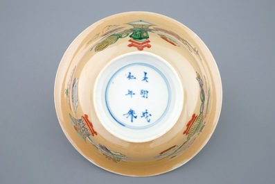 A Chinese famille verte caf&eacute; au lait ground bowl with precious objects, Kangxi