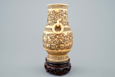 A Chinese carved ivory hu vase on wooden stand, 19th C.