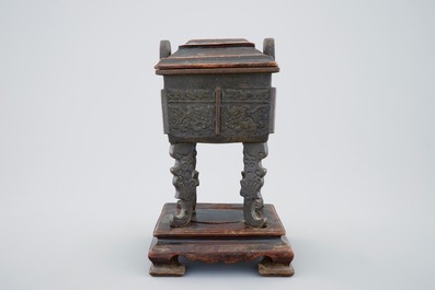 A Chinese bronze Fang Ding censer on stand with wood cover, 18/19th C.