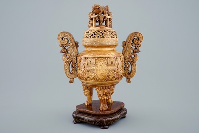 A Chinese carved ivory tripod censer on wooden base, 19th C.