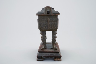 A Chinese bronze Fang Ding censer on stand with wood cover, 18/19th C.