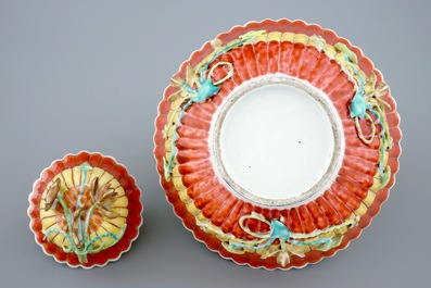 A Chinese relief-decorated grisaille and iron red cup and saucer with matching bowl, Yongzheng, 1723-1735