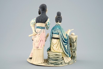 A Chinese polychrome carved ivory group of a lady with children, 19/20th C.