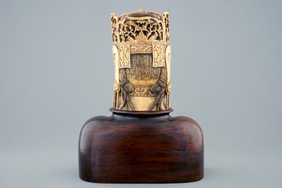 A Chinese carved ivory head of Buddha on wooden stand, 19th C.