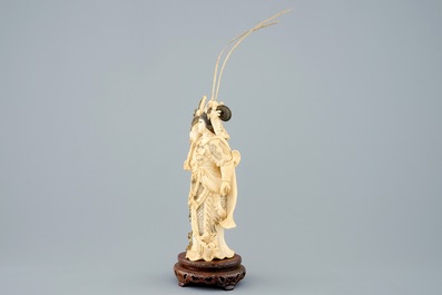 A Chinese carved ivory figure of Hua Mulan on a wooden base, late 19th C.