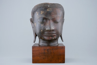 A gold-splashed bronze head of Buddha, South-East Asia, 19/20th C.