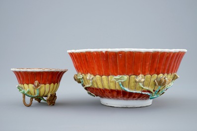 A Chinese relief-decorated grisaille and iron red cup and saucer with matching bowl, Yongzheng, 1723-1735