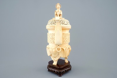 A Chinese carved ivory censer on a wooden base, ca. 1900
