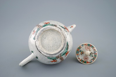 A Chinese famille verte crackle glazed ground teapot and cover, Kangxi