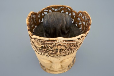 A Chinese carved ivory head of Buddha on wooden stand, 19th C.