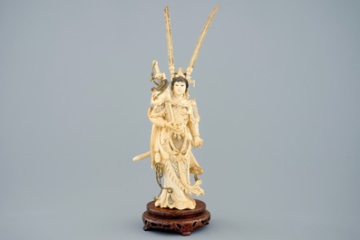 A Chinese carved ivory figure of Hua Mulan on a wooden base, late 19th C.