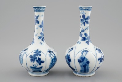 A pair of Chinese blue and white bottle shaped vases with long Elizas, Kangxi