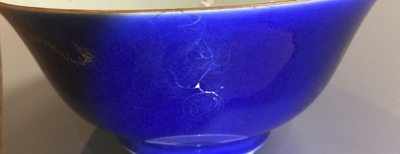 A Chinese powder blue and gilt dragon bowl, 18/19th C.