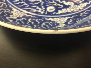 A pair of Chinese blue and white dragon dishes, Kangxi mark and of the period