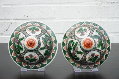 A pair of Chinese famille verte vases and covers with mythical beasts, 19/20th C.