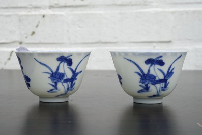 A pair of Chinese blue and white wine cups with 4 floral patterns, six-character mark, Kangxi