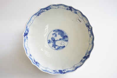 A Chinese blue and white soft paste bowl with horseriders, Kangxi