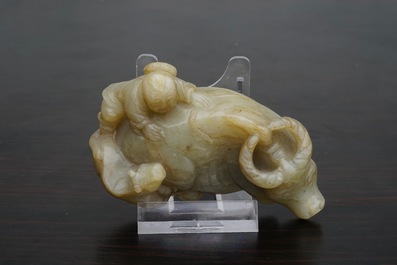 A Chinese jade group of a boy on a buffalo, 18/19th C.