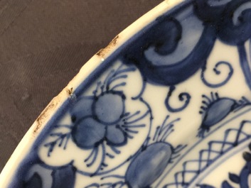 A rare Chinese blue and white plate after a Dutch Delft example, Qianlong, 18th C.